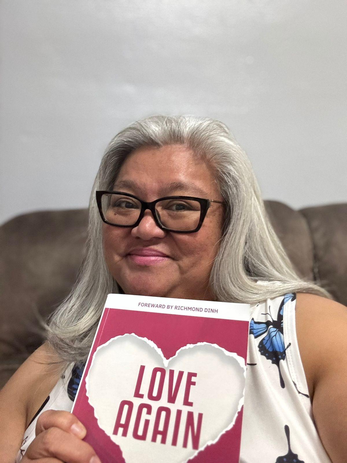 Widow holding Love Again book